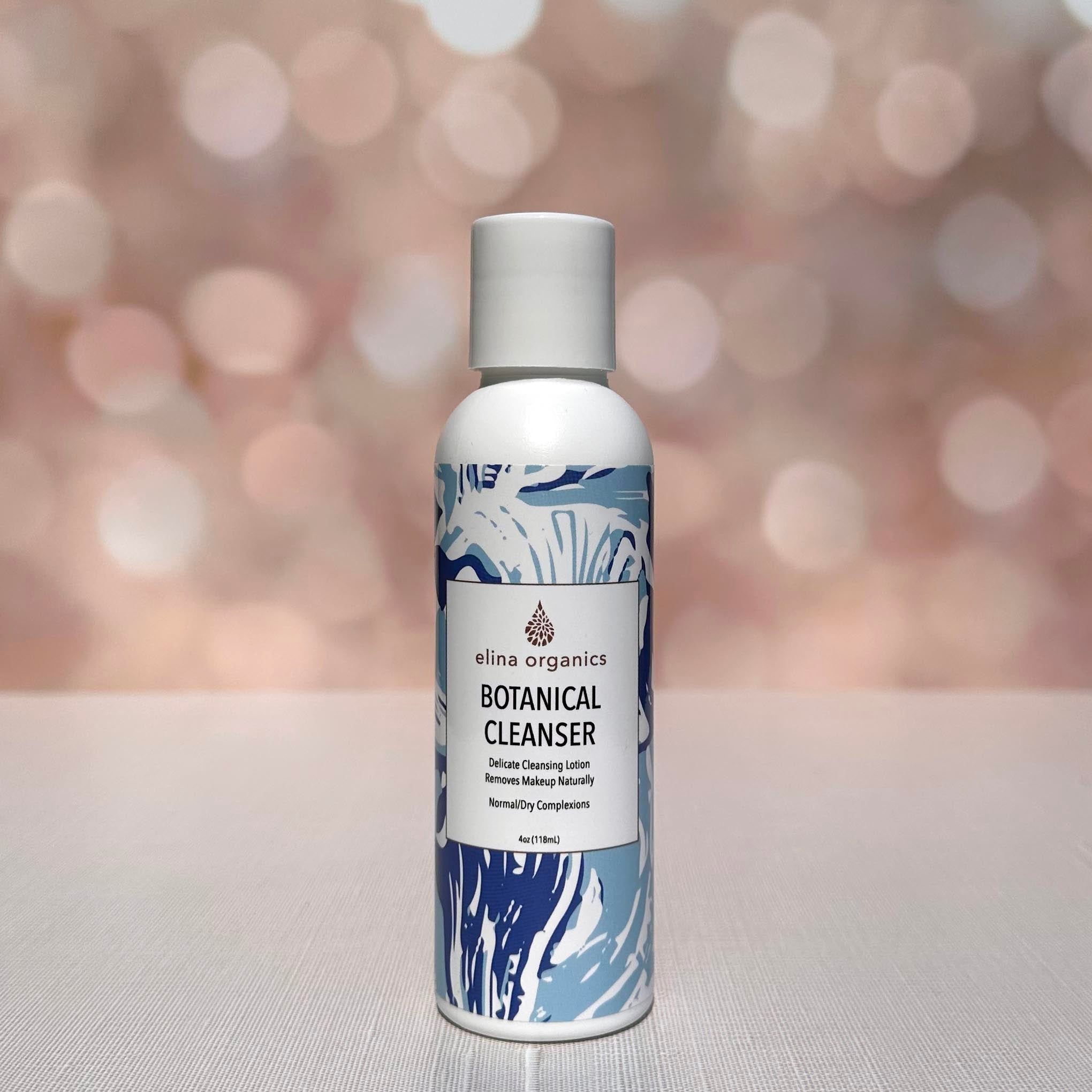 Elina Organics Botanical Cleanser in front of a sparkling background