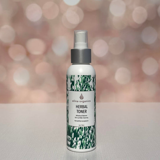 Elina Organics Herbal Toner in front of a sparkling background